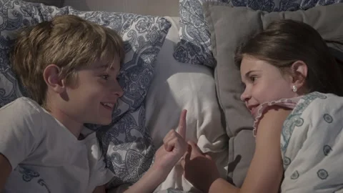 Children talking in bed. Stock Footage 166000184