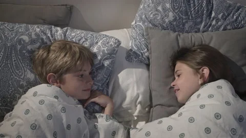 Children talking in bed. Stock Footage 166326972