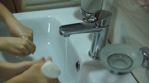 Children thoroughly washes his hands with soap, snaryu pandemic СOVID 19 Stock Footage 128616722