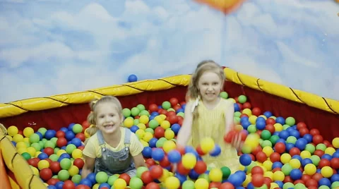 Children throw the balls in ball pool. slow motion Stock Footage 64366720