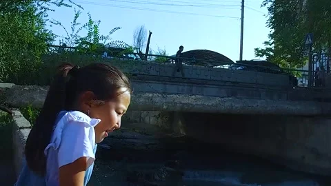 Children throw garbage into the river. Stock Footage 251953427