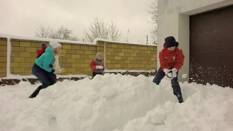 Children throw snow. Slow motion. Video stock 74666190