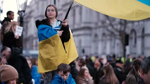 Children with Ukrainian Flags at Protest against Invasion of Ukraine, London Stock Footage