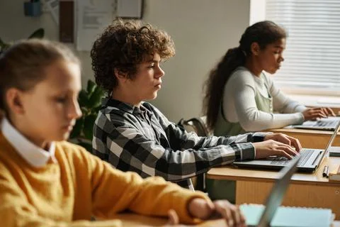 Children using computers at their study 스톡 사진