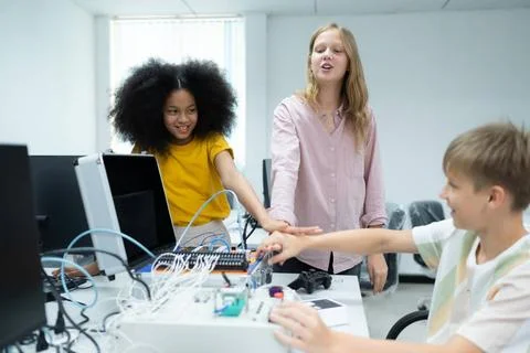 Children using the hand robot technology and having fun Learning, Students... Stock-Fotos