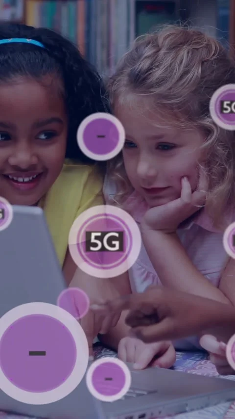 Children using laptop with 5G technology animation overlay in library setting Stock Footage 344403970