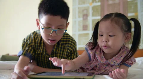 Children using a tablet computer Stock Footage 67580304