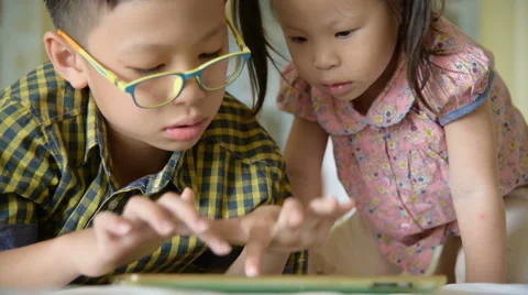 Children using a tablet computer Stock Footage