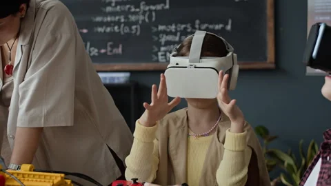 Children Using Vr Headsets in Robotics Lesson with Female Teacher Stock Footage 339196863