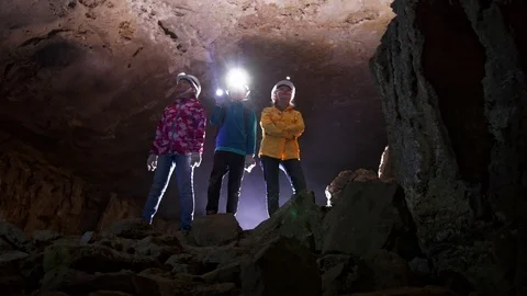 Children visiting the minerals in the cave Stock Footage 91984265