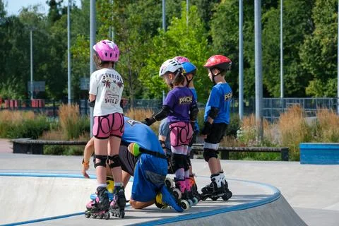 Children Waiting for Inline Skating Lesson at Skatepark Stock Photos