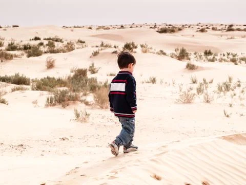 Children walk in the desert Stock Photos