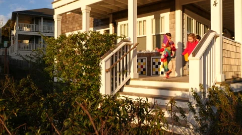 Children walk down steps on way to beach Stock Footage 55667142
