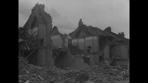 Children walk past decimated buildings after being bombed by V-1 rocket Stock Footage