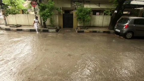 Children walk to school in rain Video stock 94904052