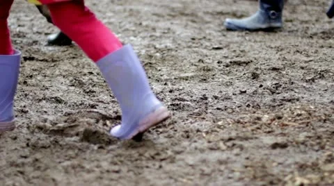 Children walk through mud while making wolf noises Stock Footage 20541141