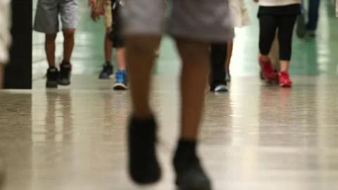 Children walking through Gilmartin Elementary School hallway Stock Footage 304367657