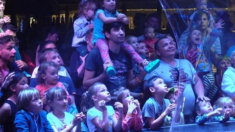 Children watch the evening animation program. Video stock 111907893