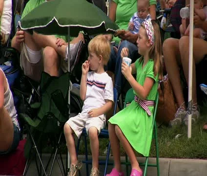 Children watch parade Stock Footage 21668904