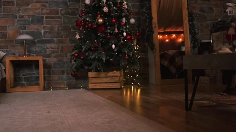 Children watching and chasing Santa Claus, family on New Year's Eve Stock Footage 251791998