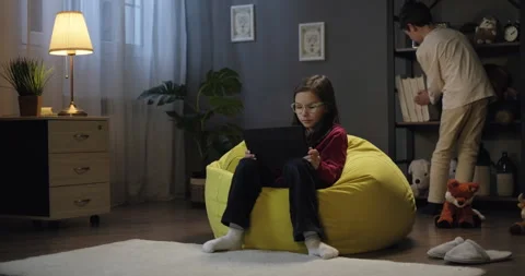 Children watching educational video webinar on digital tablet in the evening at Stock Footage 276484855