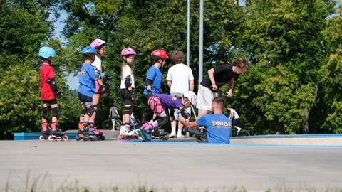 Children Watching Inline Skating Training at Outdoor Skatepark Stock Photos