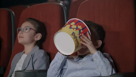 Children watching movies in cinema. Movie entertainment for kids Stock Footage 93899037