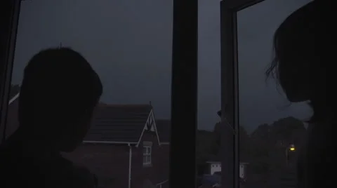 Children Watching A Powerful Thunderstorm Stock Footage 60236734
