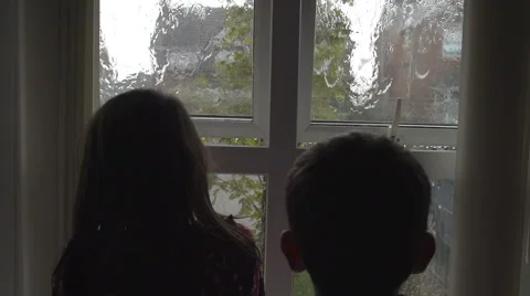 Children Watching Rain Drops On Window 스톡 동영상 60238158