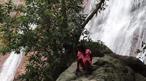 Children on the waterfall Stock Footage 50136974