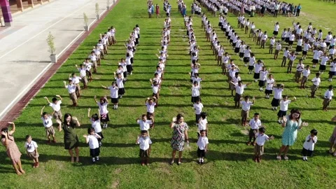 Children waving to the drone Stock Footage 194445621