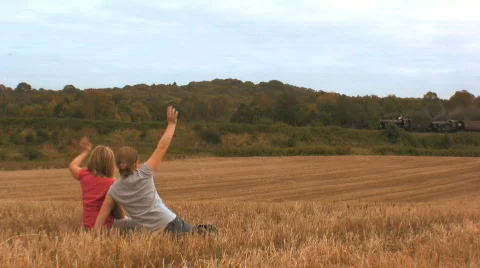 Children waving at a Steam train Stock Footage 521832