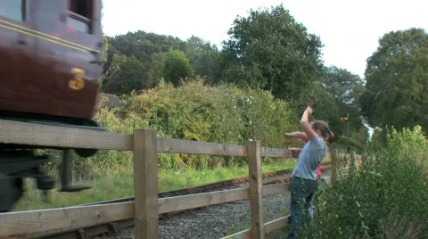Children waving at a Steam train Stock Footage 534707