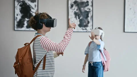 Children Wearing Vr Headsets Interacting with Virtual Art Gallery Stock Footage 343609840