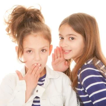 Children whispering secrets Stock Photos