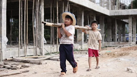 Children working at construction site.  Poor children are forced to work in.. Video stock 336941950