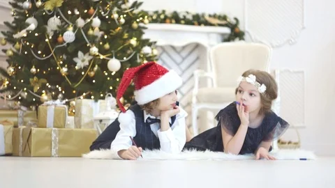 Children write letters to Santa Claus. To children it is cheerful. Stock Footage 70781017