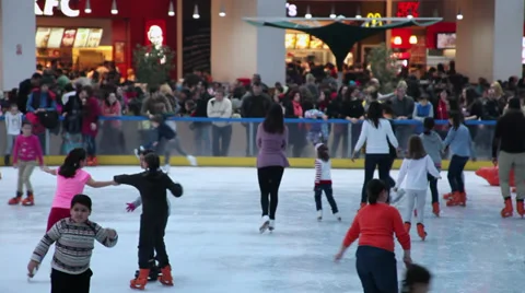 Children &amp; young people skating on a mall ice rink, sport, fast food area Stock Footage 34689130