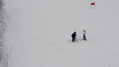 Children's Alpine skiing competitions in the open air in winter Stock Footage 102481246
