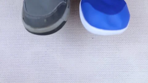 Children's anatomical shoes compared to narrow shoes that deform the foot. Small Stock Footage 285134553