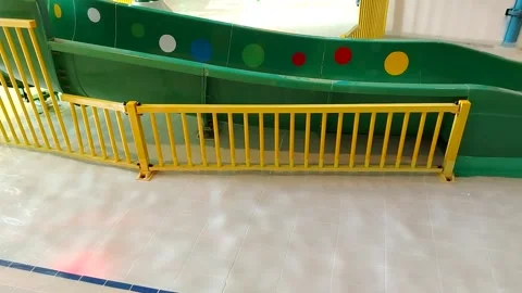 Children's area with a shallow pool and play attractions for small children Stock Footage 308307956