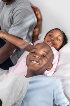 Childrens in the bed Stock Photos