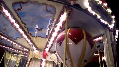 Children's carousel with horses at night Stock Footage 154583220