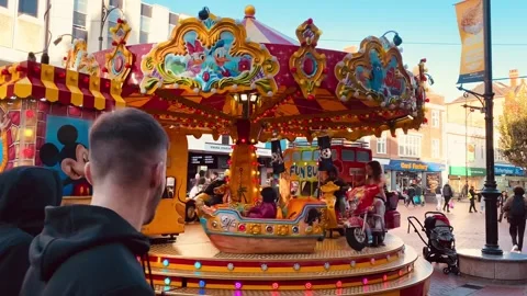 A children's carousel in Reading, UK Stock Footage 254977970