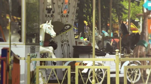 Children's carousel spinning in the park Stock Footage 50565868