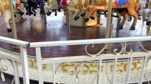 Children's carousel through the railing of the fence. The concept of the end Video stock 96145108