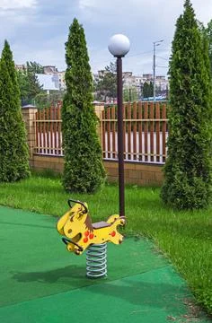 Childrens carousel on twisted spring Stock Photos