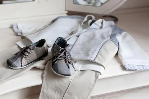 Children's clothes on the white Stock Photos