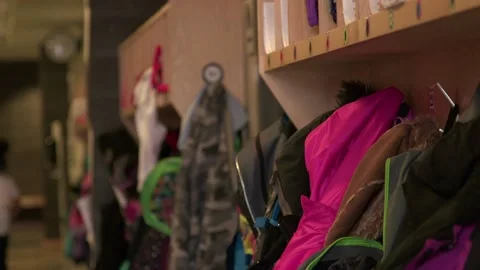 Children's Coats Hang on Hooks in School Hallway 動画素材 134587589