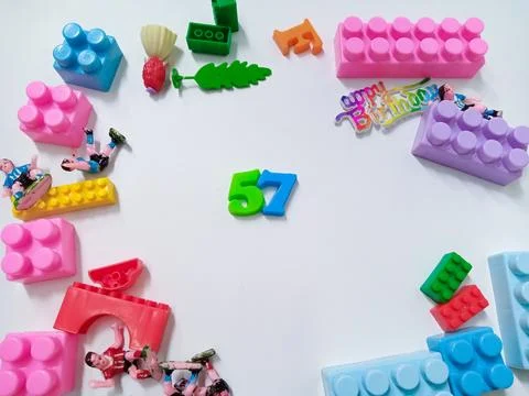 Children's colored plastic Block Bricks. Colorful kids toys frame on white .. Stock Photos